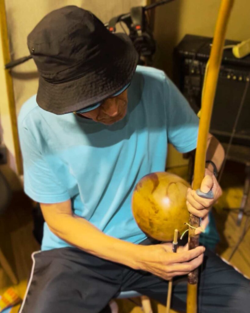 Berimbau lesson during a Musical Getaways Brazil music tour